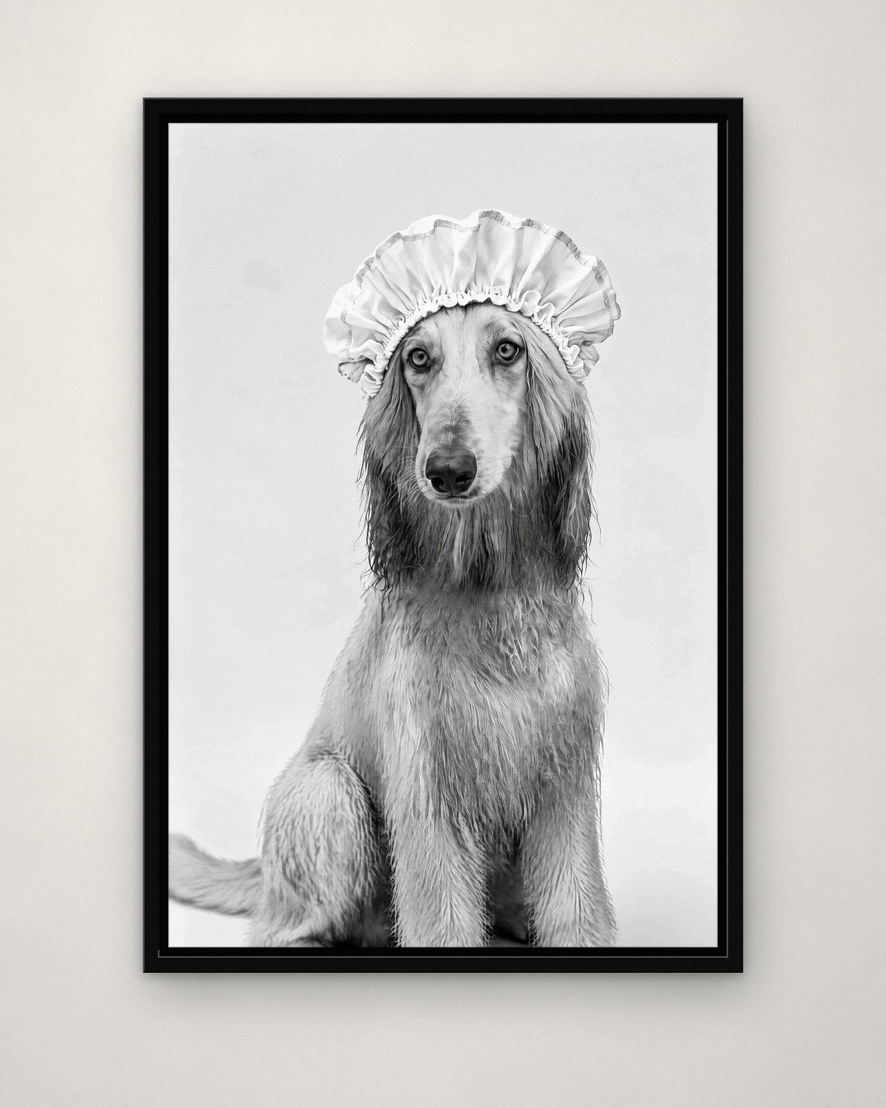 Bath Bonnet portrait on canvas in a black floating frame on a plain wall