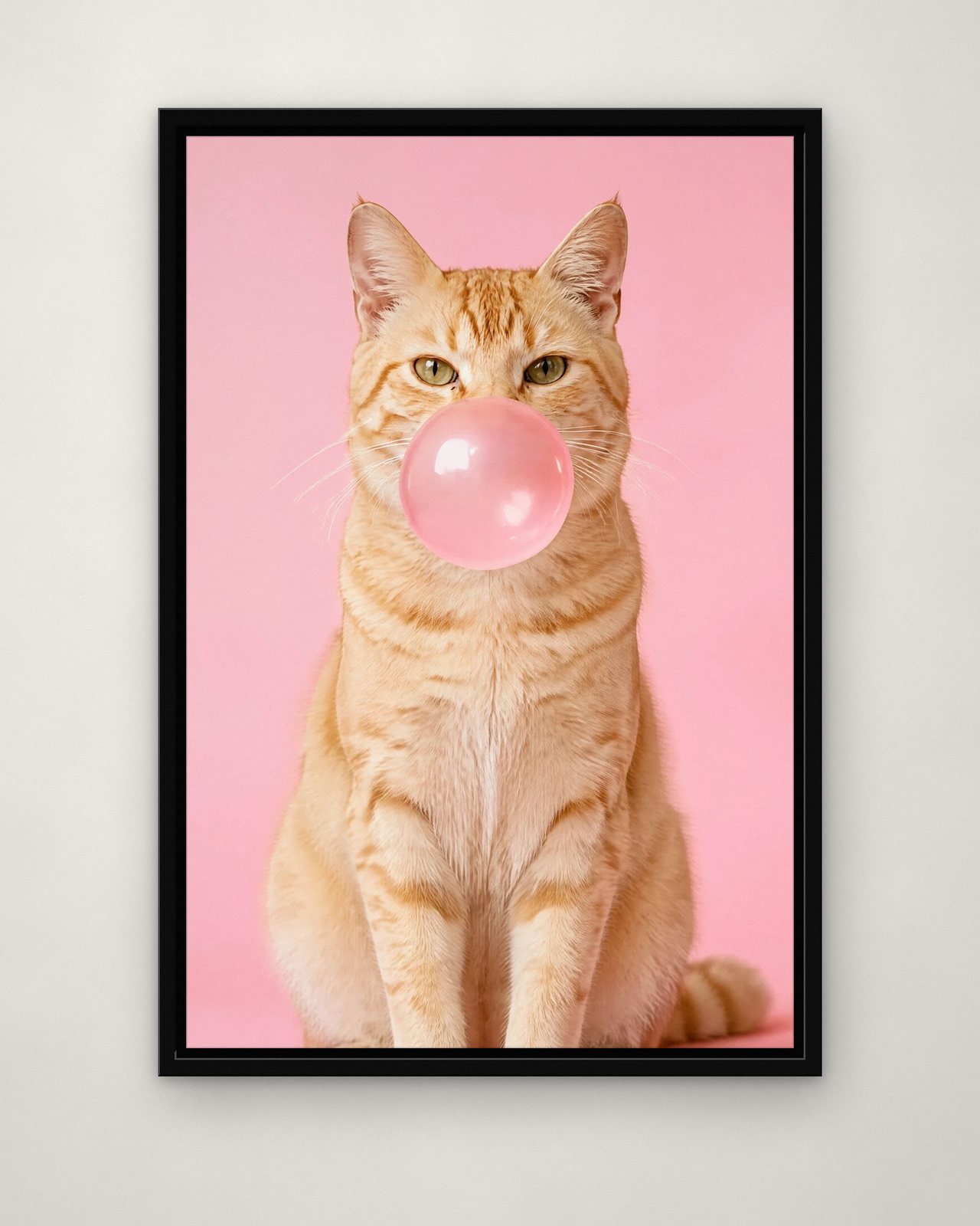Bubblegum Pink portrait on canvas in a black floating frame on a plain wall