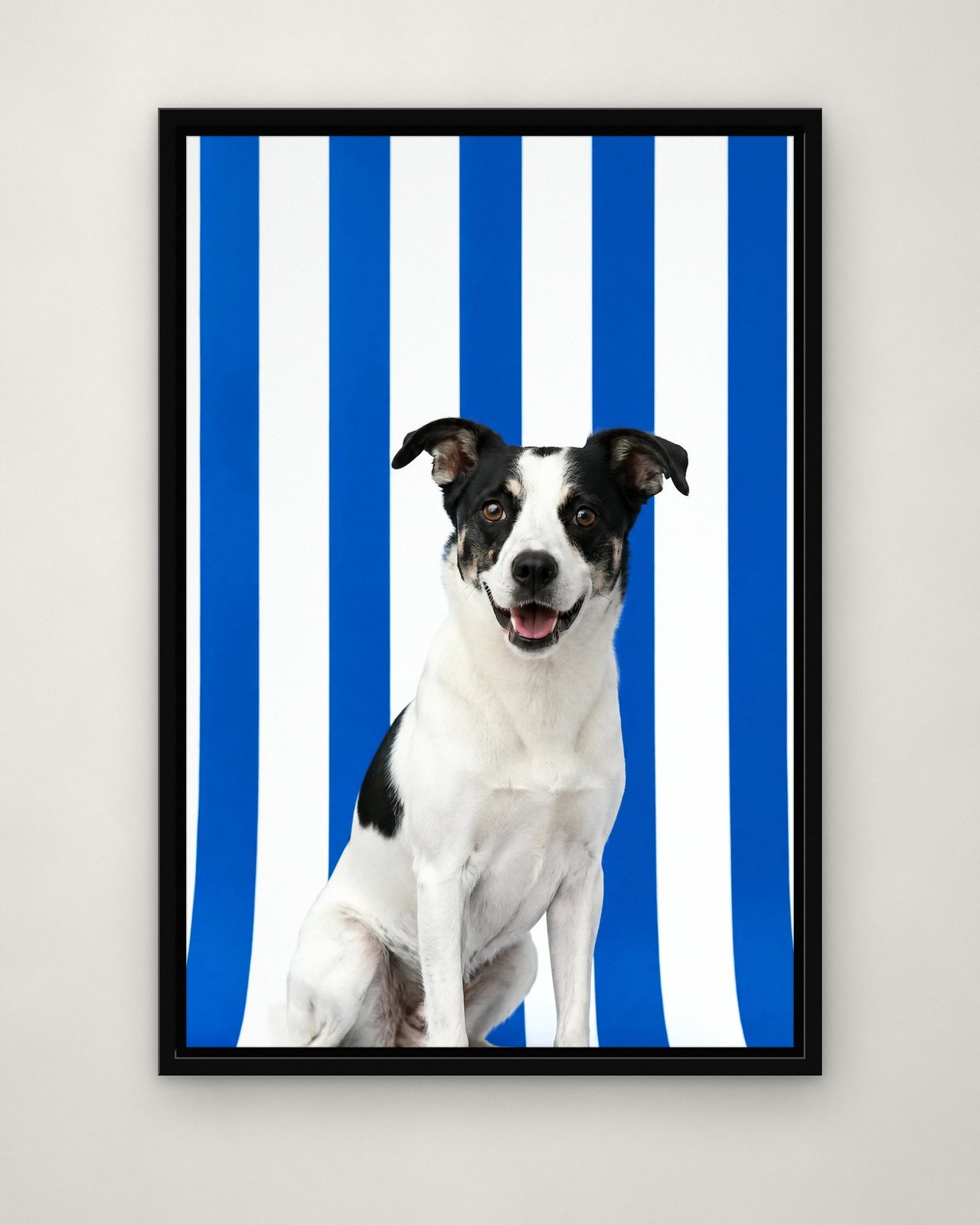 Bold Stripes portrait on canvas in a black floating frame on a plain wall