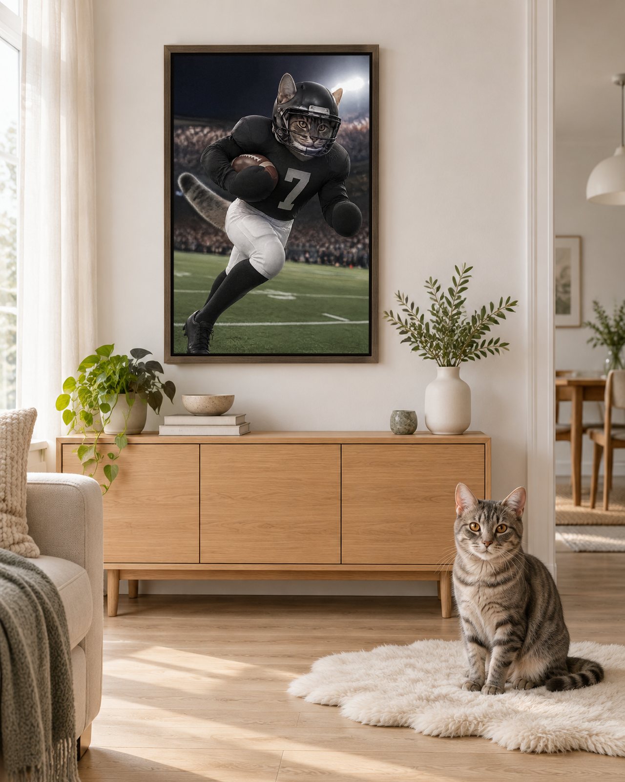 Touchdown portrait on canvas in a brown floating frame in a Scandinavian living room, with the cat beside it
