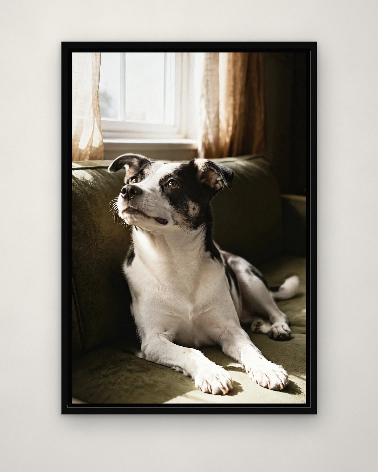 Window Light portrait on canvas in a black floating frame on a plain wall