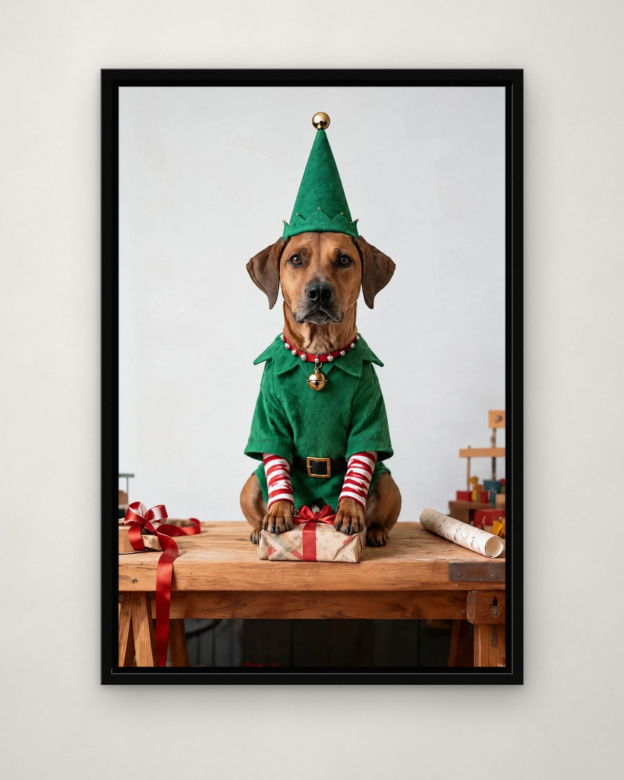 Head Elf portrait on canvas in a black floating frame on a plain wall