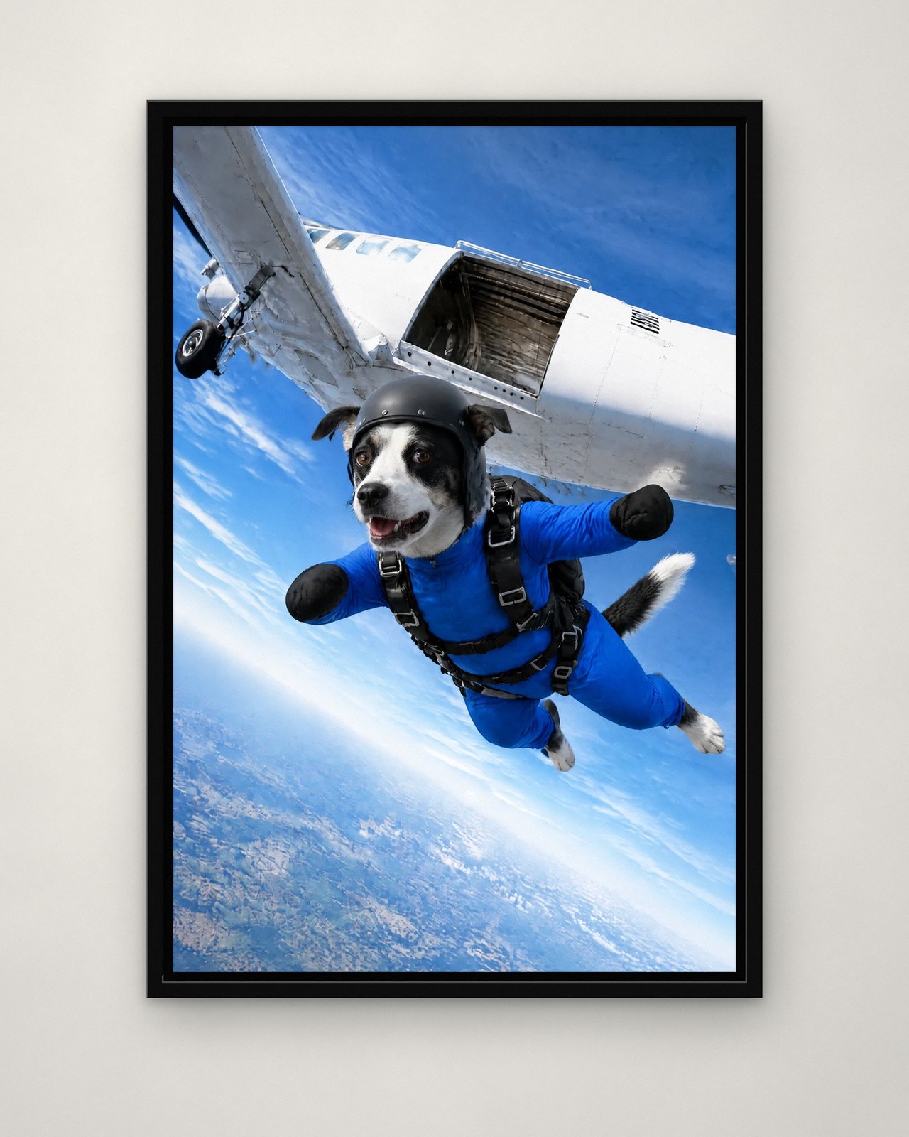 Plane Jump portrait on canvas in a black floating frame on a plain wall