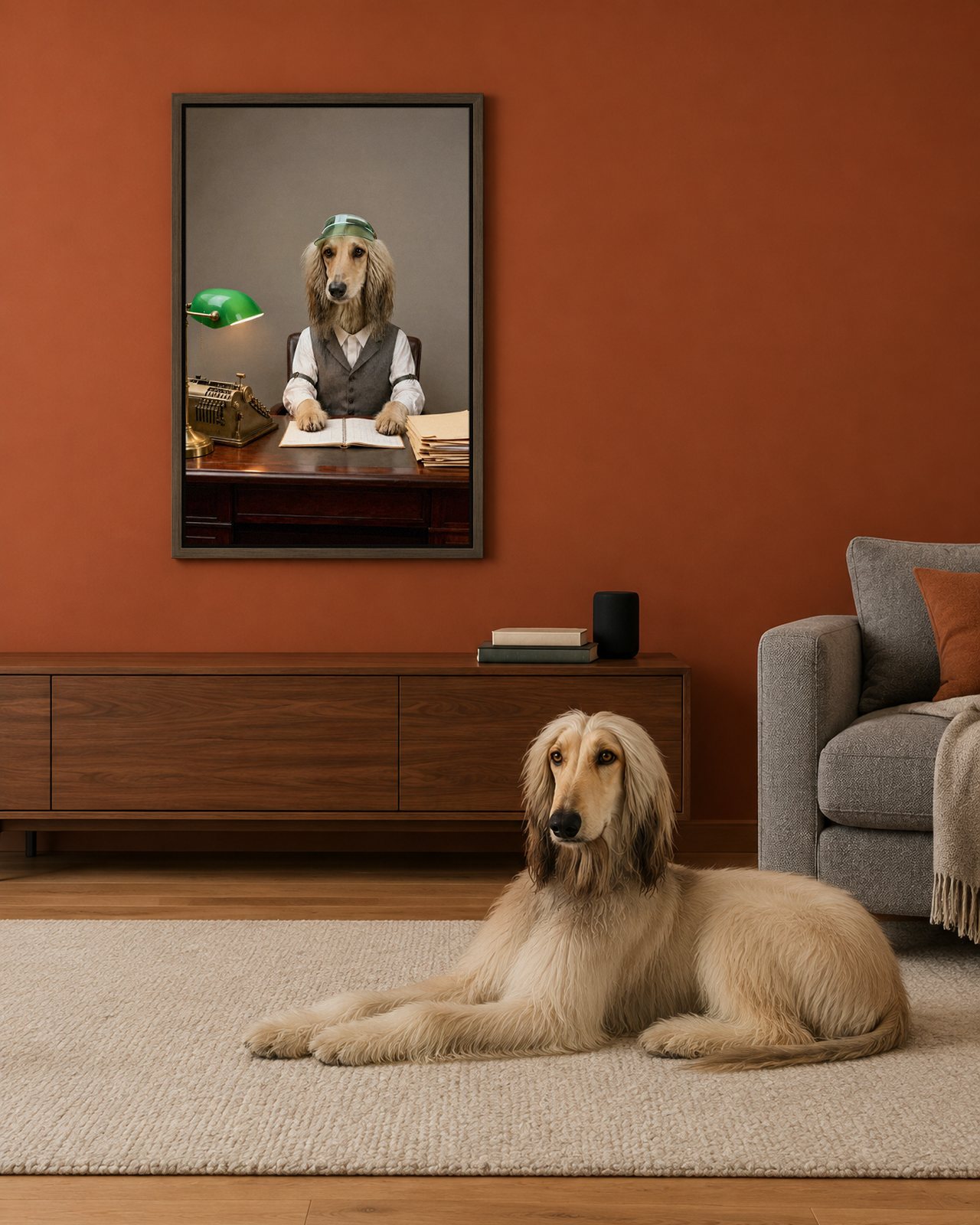 The Bookkeeper portrait on canvas in a brown floating frame in a rust-orange media room, with the dog beside it