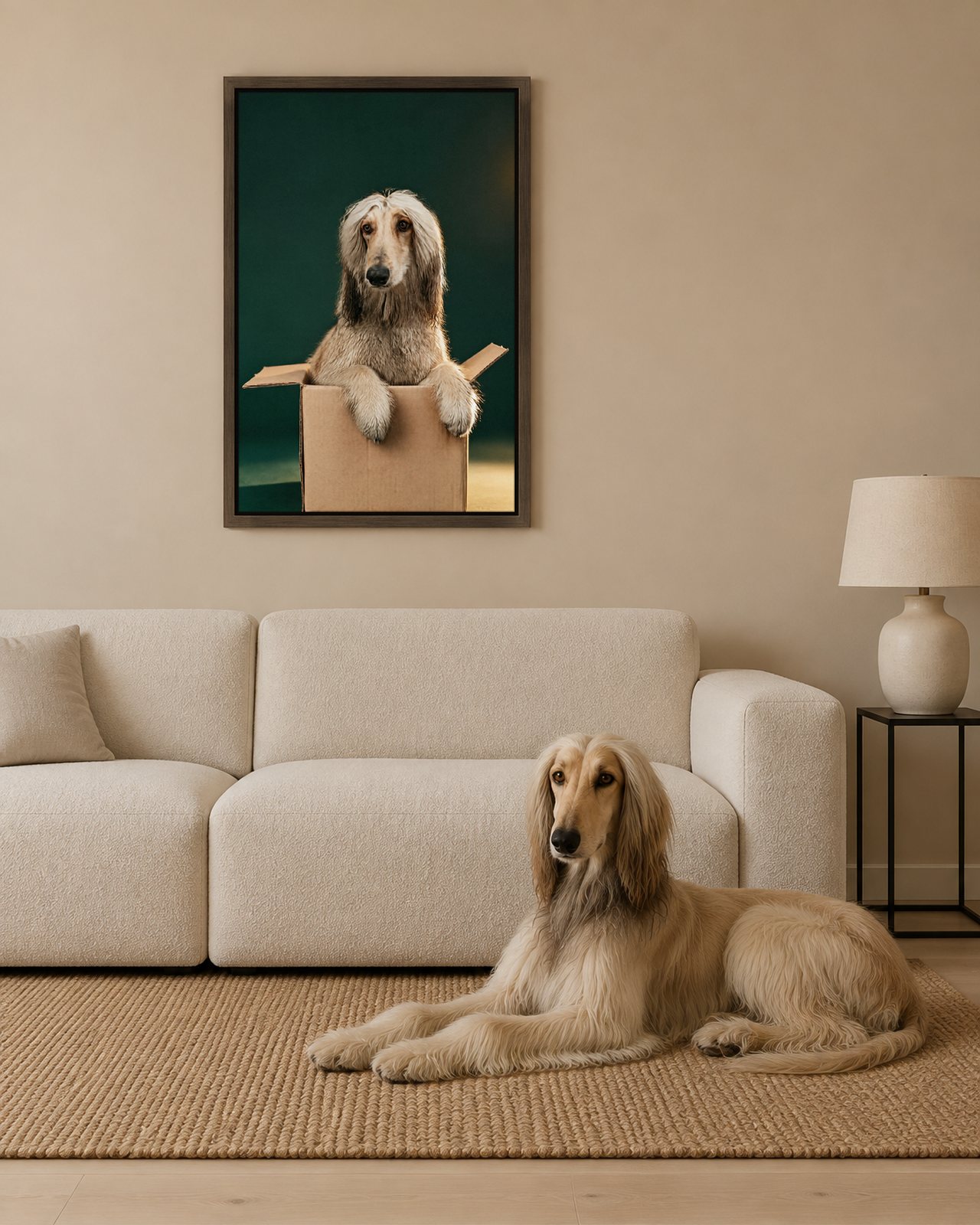 Box Too Small portrait on canvas in a brown floating frame in a sand-coloured living room with a low sofa, with the dog beside it